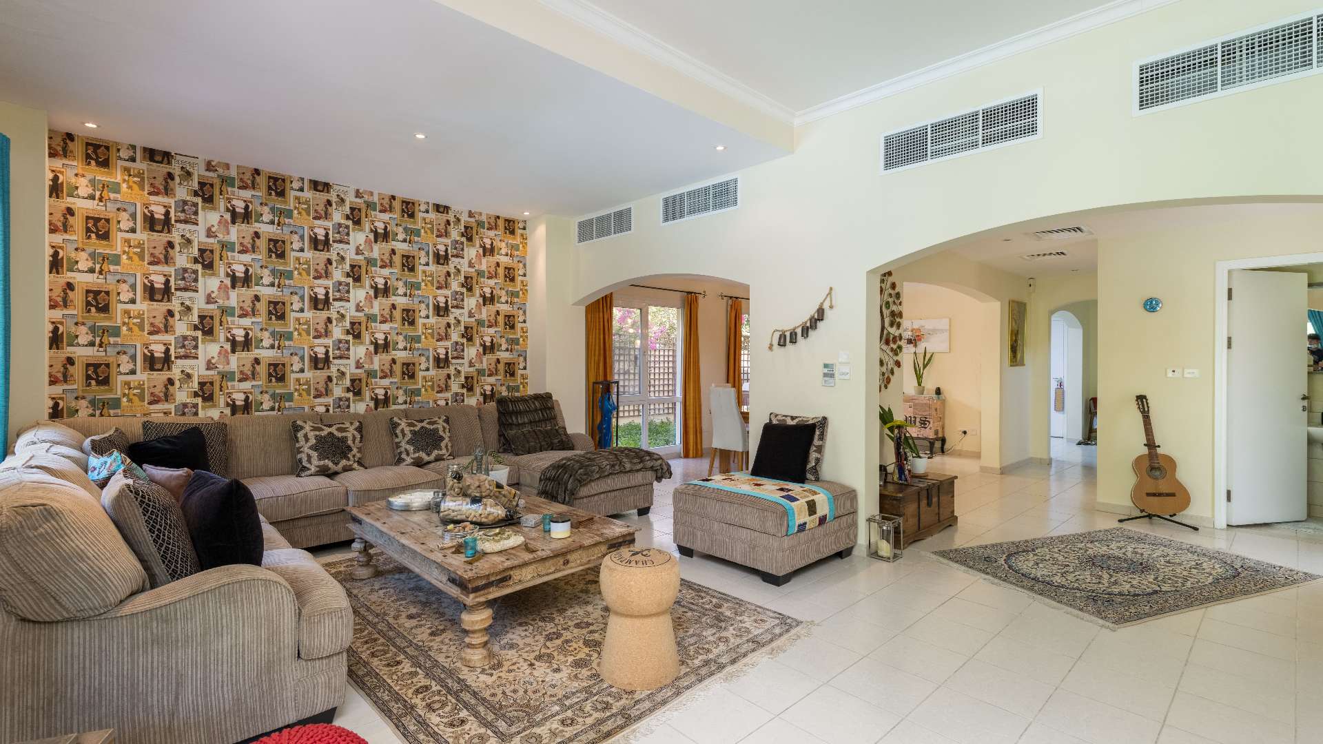 "Bright bedroom with balcony access in Meadows 9 villa for sale, Ref: LP09065.",Living room in Meadows 9 villa with stylish decor and cozy seating area