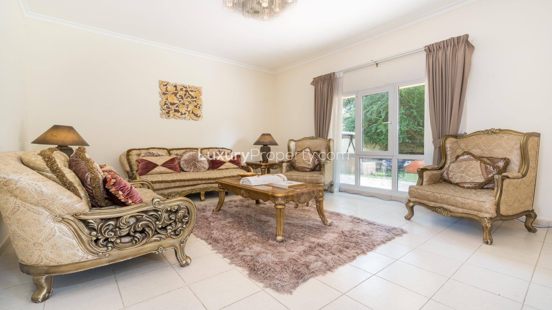 Living room of Meadows 9 villa with large windows and cozy seating area