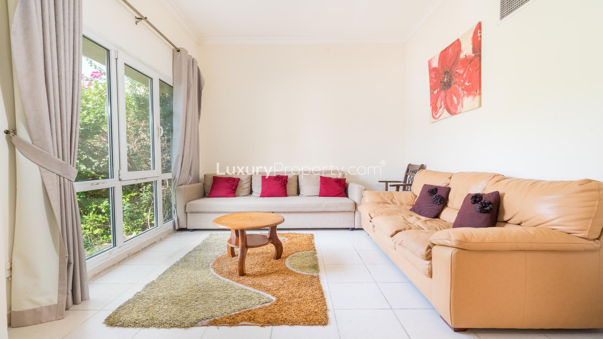 Spacious hallway in three-bedroom villa, Meadows 9, featuring modern decor and tiled flooring