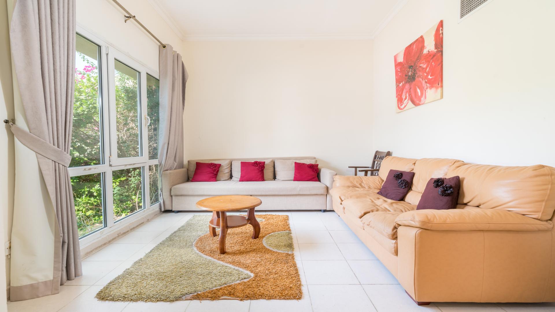 Spacious hallway in three-bedroom villa, Meadows 9, featuring modern decor and tiled flooring