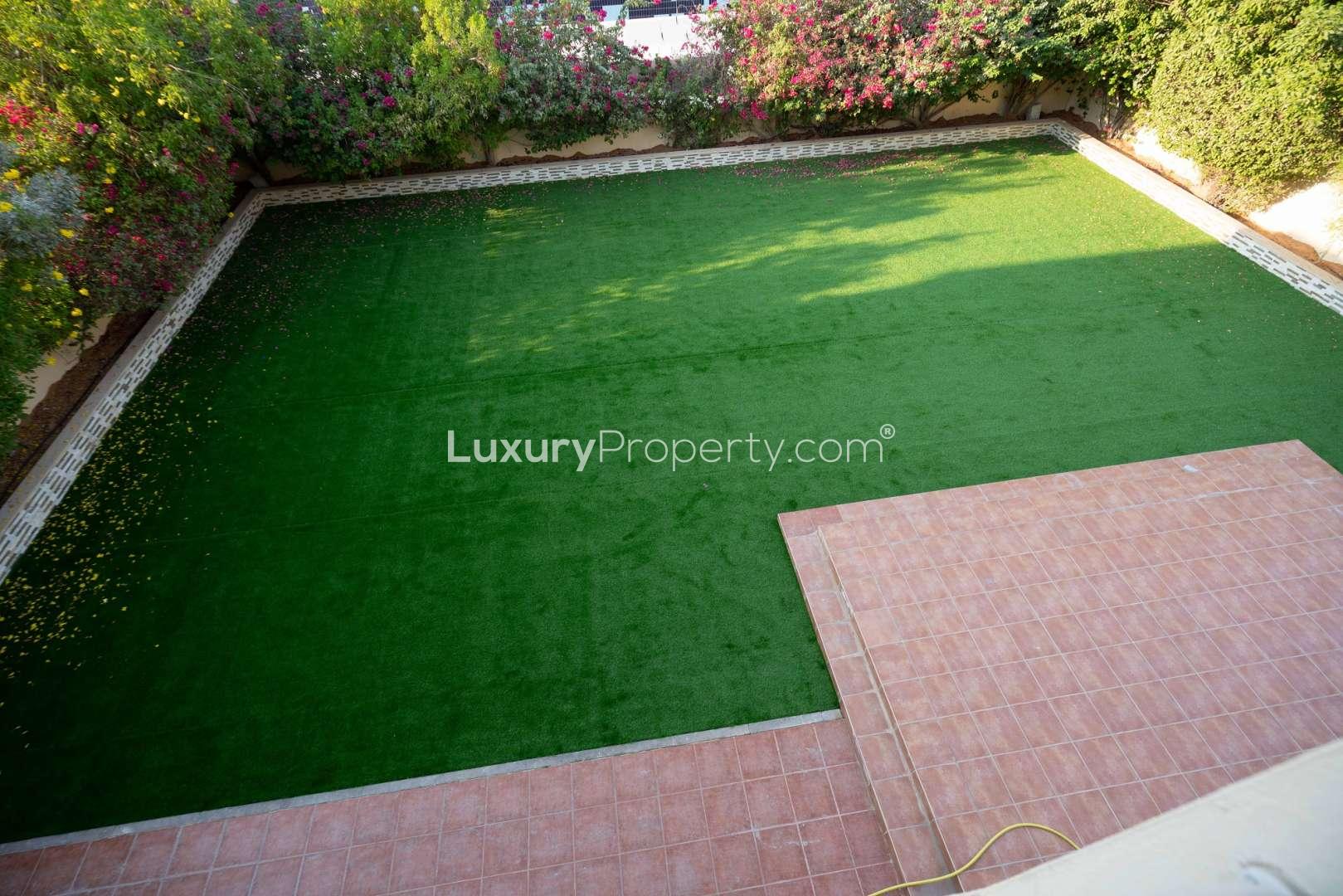 Spacious hallway in well-maintained Meadows 9 villa with tiled floors and kitchen view