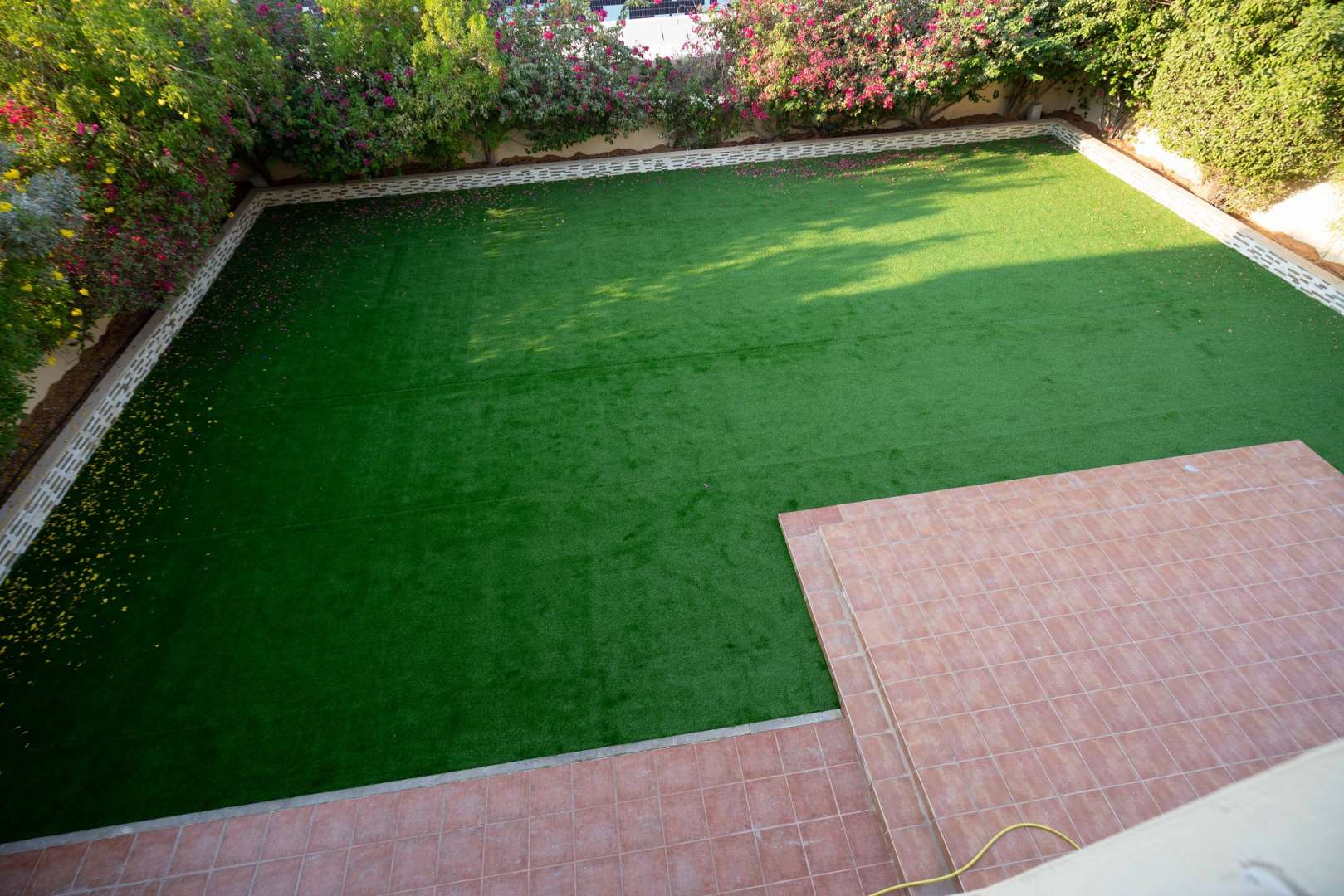 Spacious hallway in well-maintained Meadows 9 villa with tiled floors and kitchen view