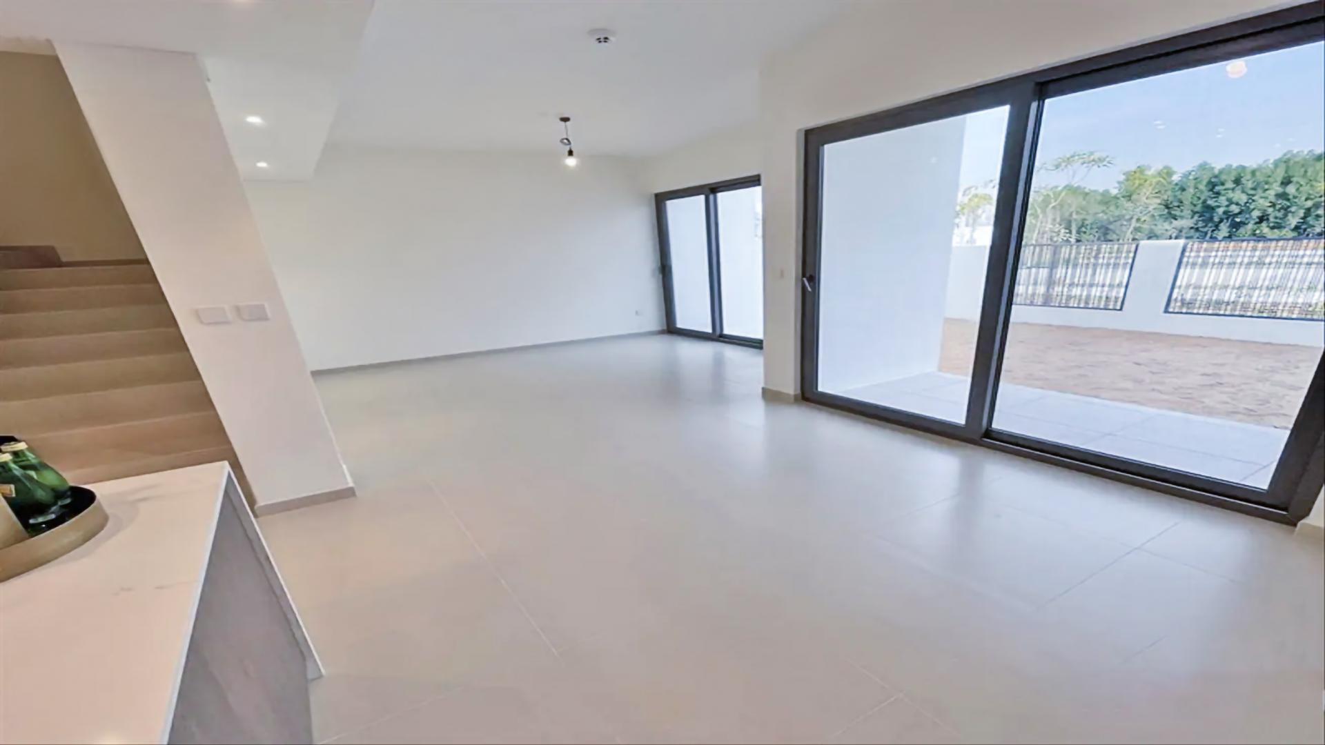 Modern villa exterior in Elan, Tilal Al Ghaf, featuring spacious driveways and contemporary design