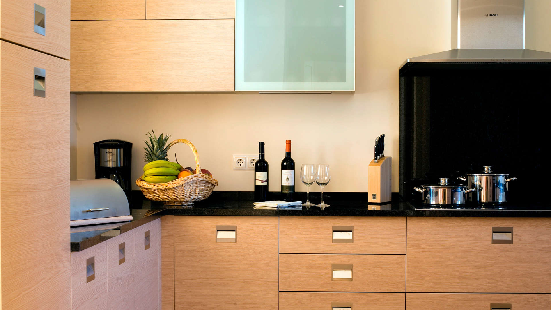 Modern kitchen in upgraded three-bedroom villa, Monte Rei, Algarve, featuring sleek cabinetry and appliances