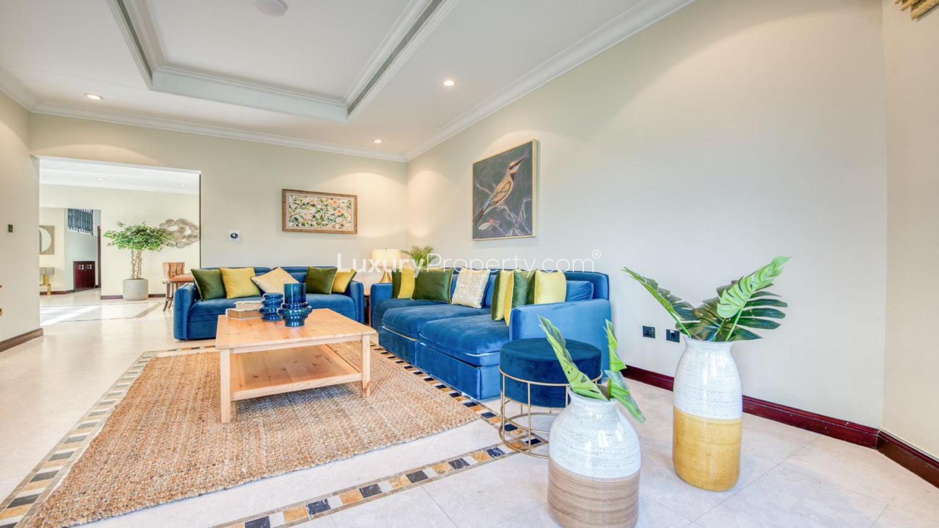 Luxurious living room in Palm Jumeirah villa, featuring elegant decor and spacious seating area