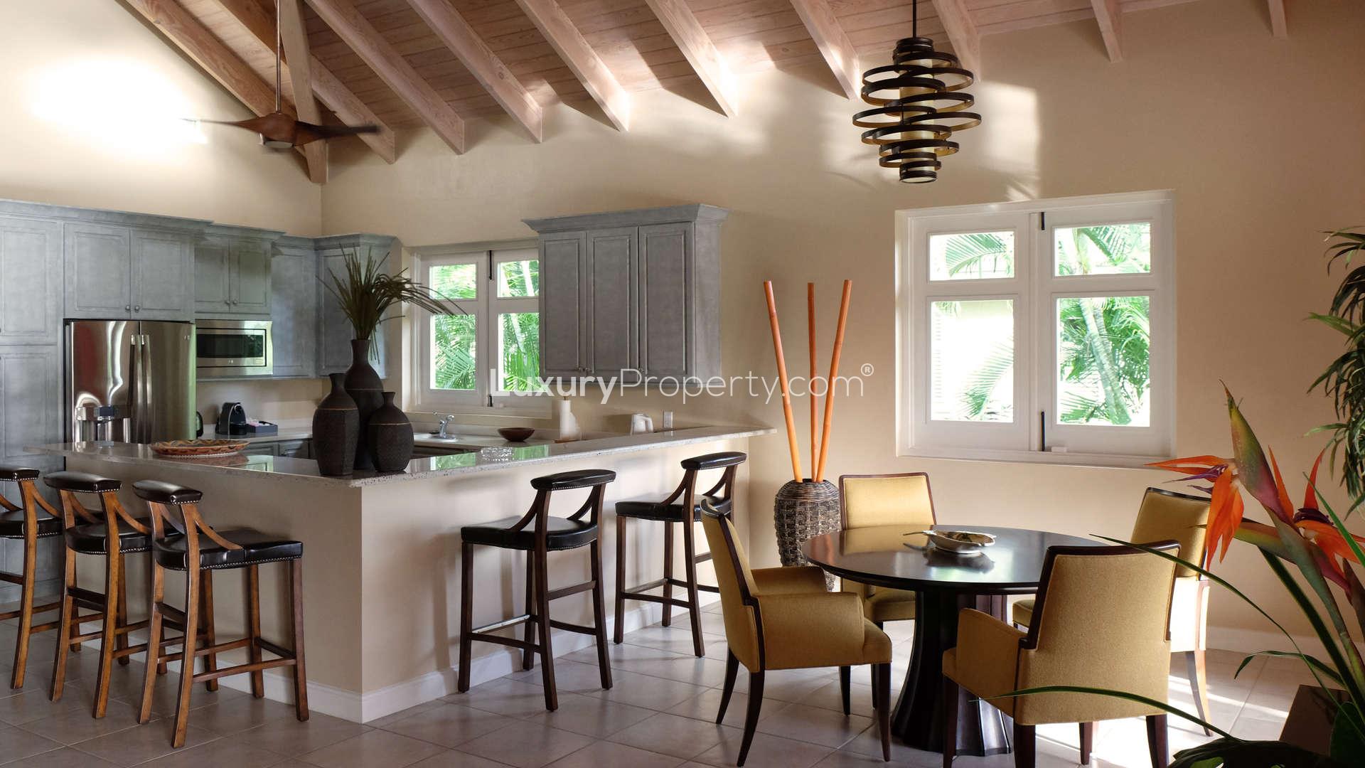 Luxurious bedroom in Nevis Estate Villa with elegant wooden furniture and vibrant decor