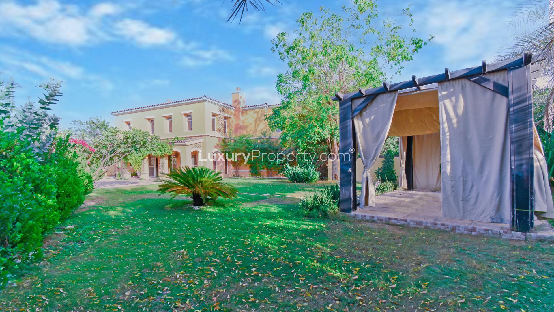 Exterior view of lush garden in upgraded villa, Palmera, Arabian Ranches, for sale