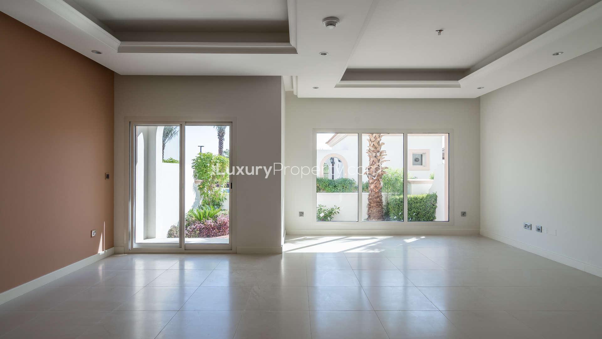 Elegant living room with garden view in 3-bedroom townhouse, Redwood Park, Jumeirah Golf Estates