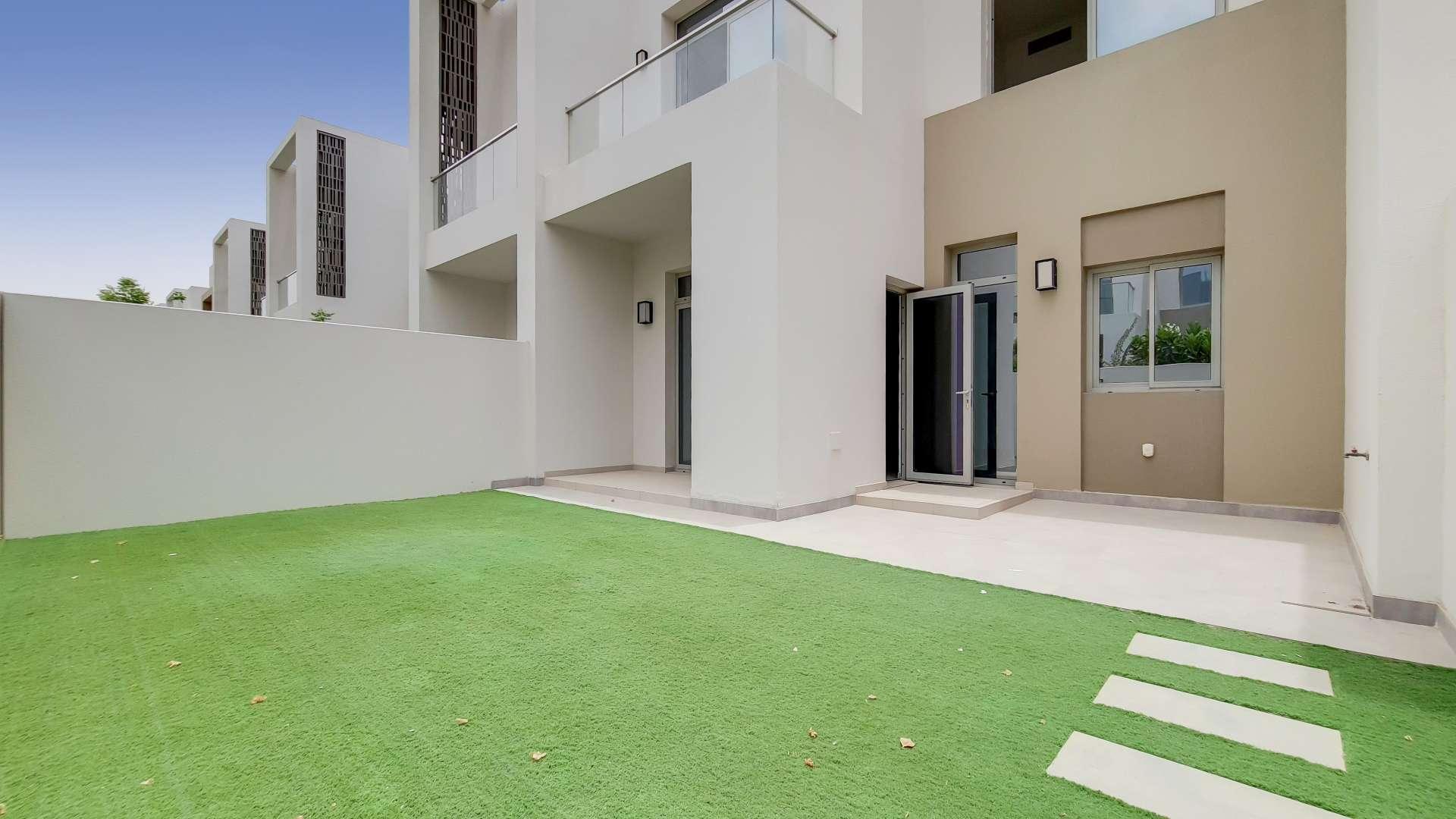 Spacious villa backyard with artificial grass in Reem Community, Arabian Ranches 2