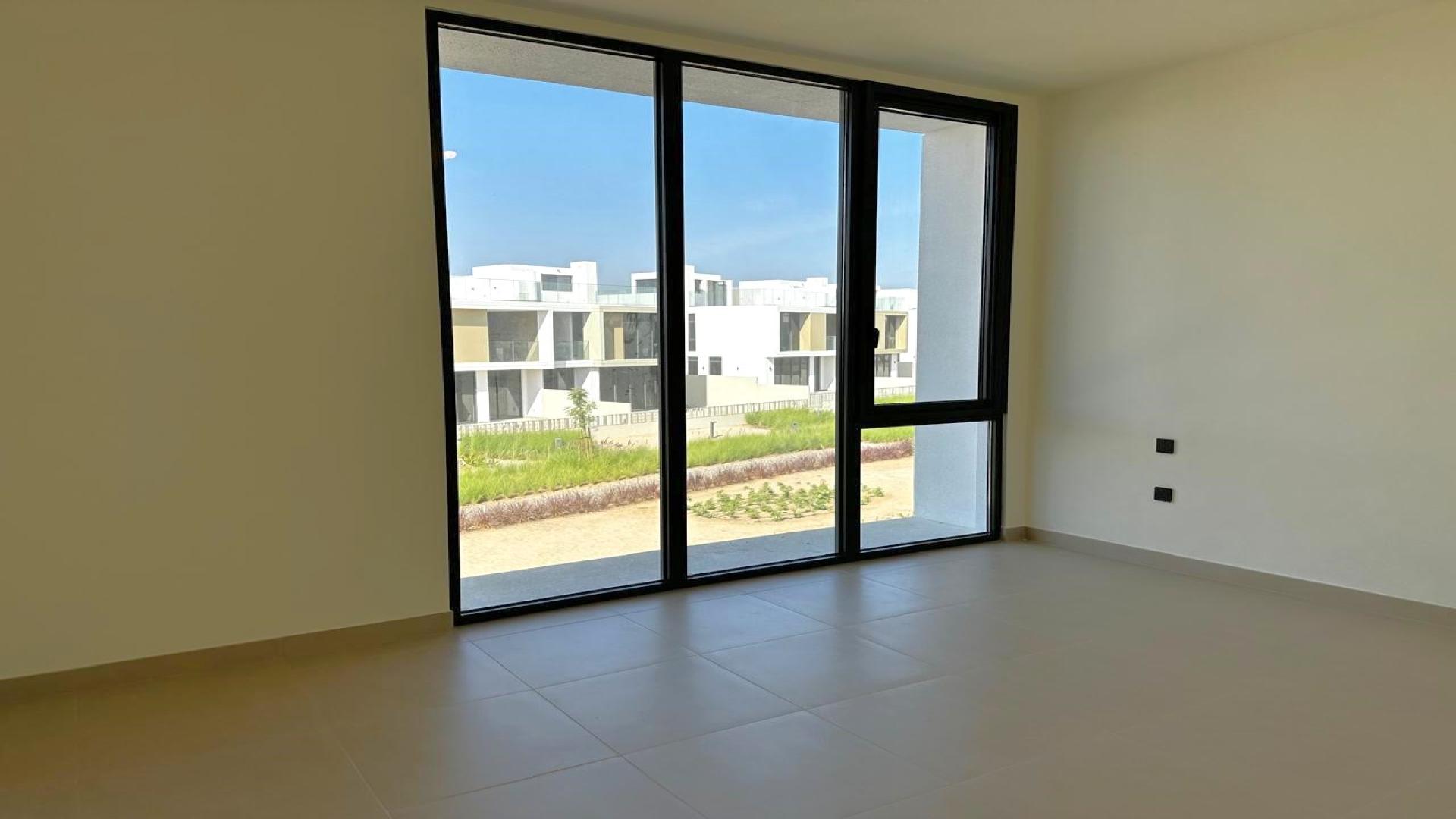 Contemporary kitchen with sleek cabinetry in Dubai Hills Estate villa, Golf Grove community