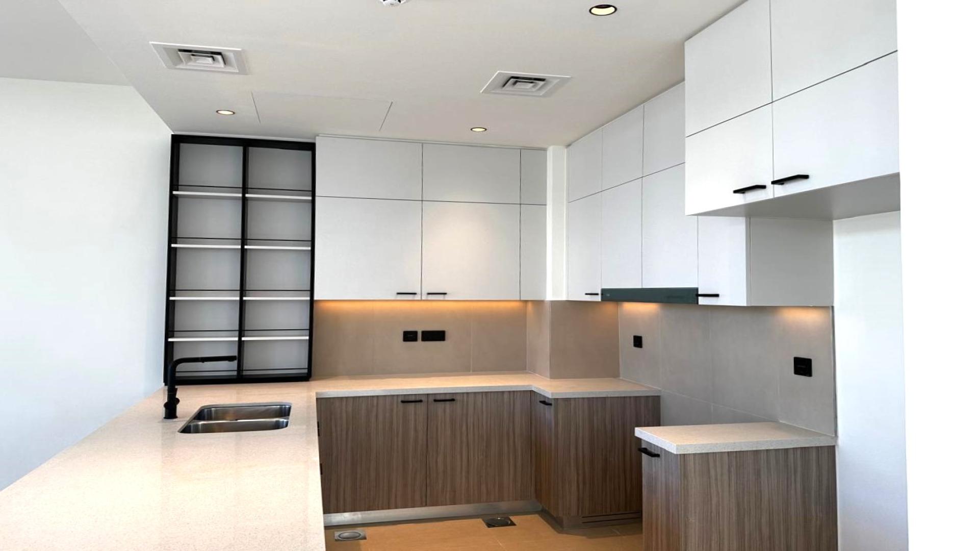 Contemporary open-plan living area with staircase in Dubai Hills Estate villa for sale