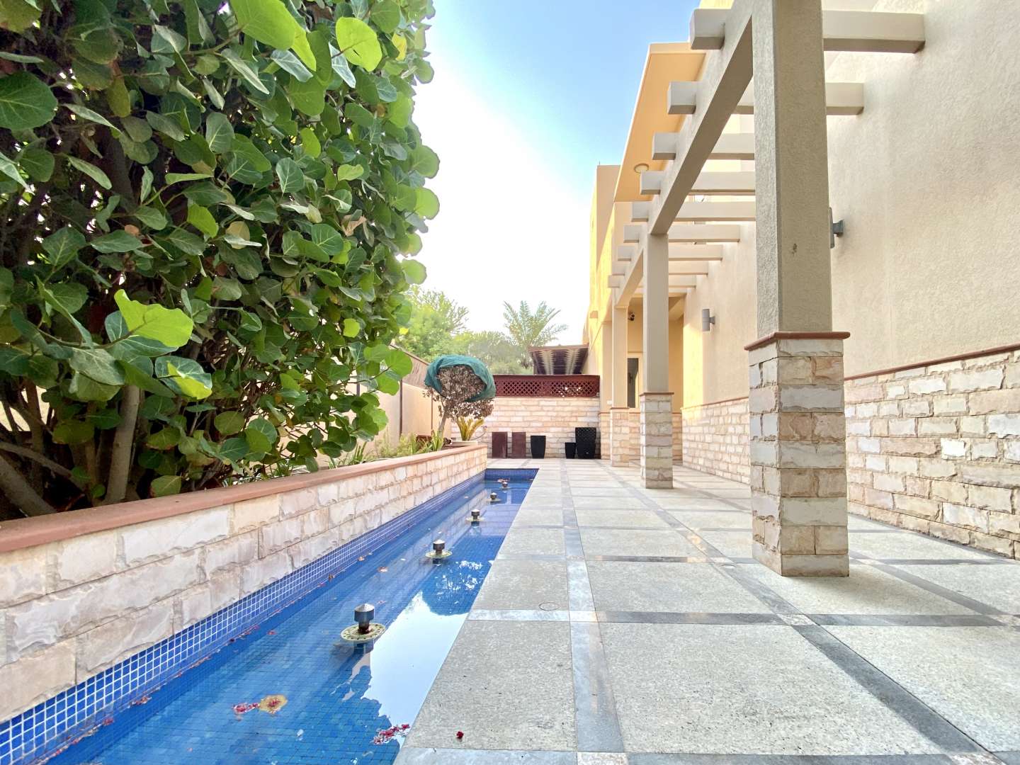 Bright living room in Saheel villa, Arabian Ranches, with garden view and modern decor