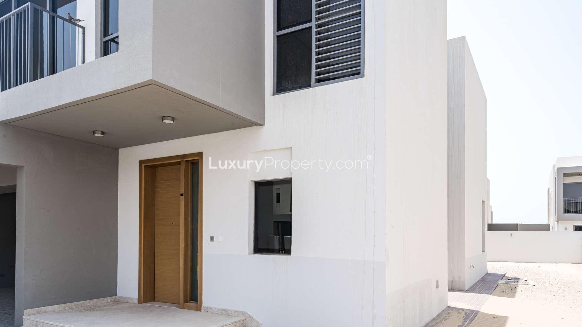 "Bright hallway with large windows in Sidra Villas, Dubai Hills Estate three-bedroom villa.",Exterior view of modern three-bedroom villa in Sidra, Dubai Hills Estate for sale