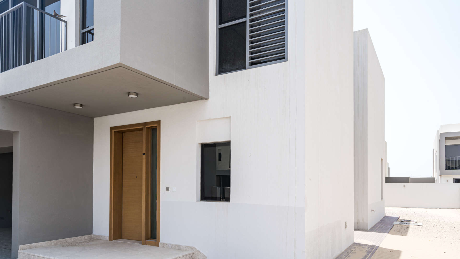 "Bright hallway with large windows in Sidra Villas, Dubai Hills Estate three-bedroom villa.",Exterior view of modern three-bedroom villa in Sidra, Dubai Hills Estate for sale