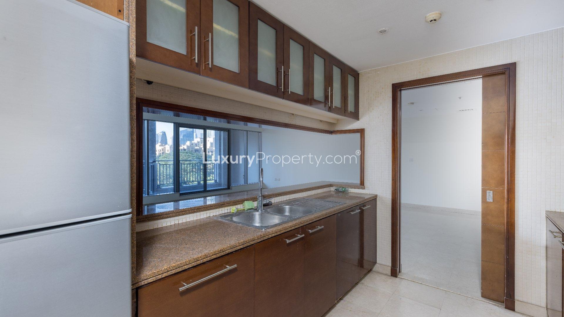 Modern kitchen in 3-bedroom villa, South Ridge, Downtown Dubai, featuring sleek cabinetry and appliances