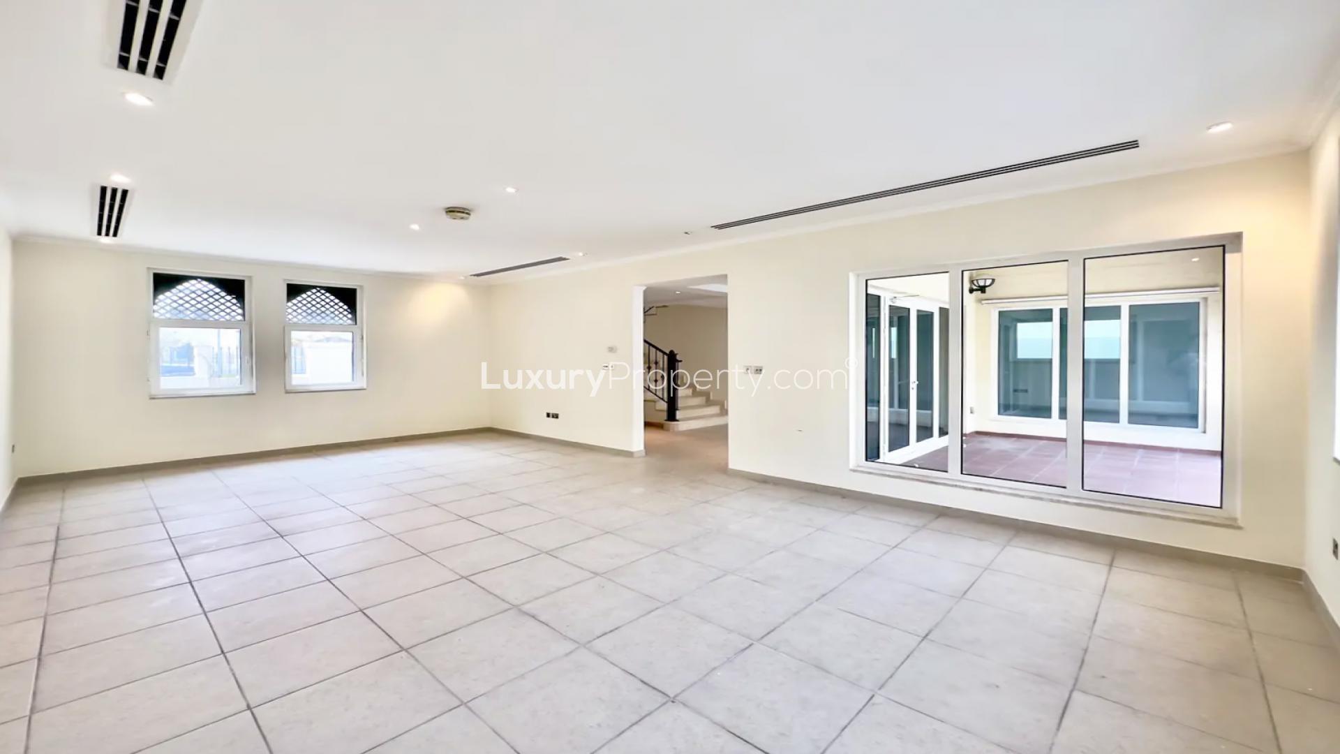 Spacious open-plan living area in Jumeirah Park villa for sale, featuring modern kitchen