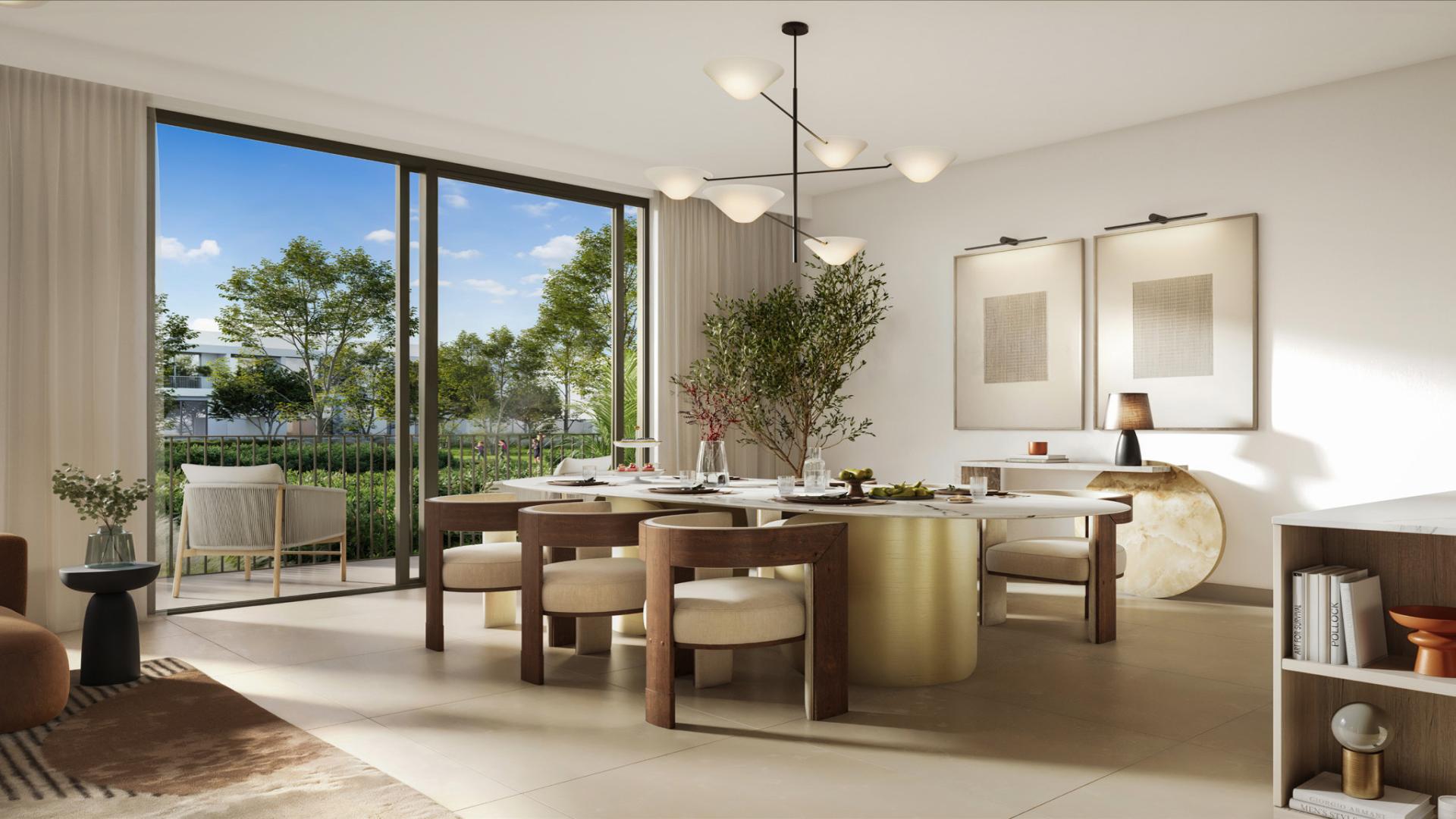 Dining area in stylish 3-bedroom townhouse, Elea, The Valley, featuring modern decor and garden view