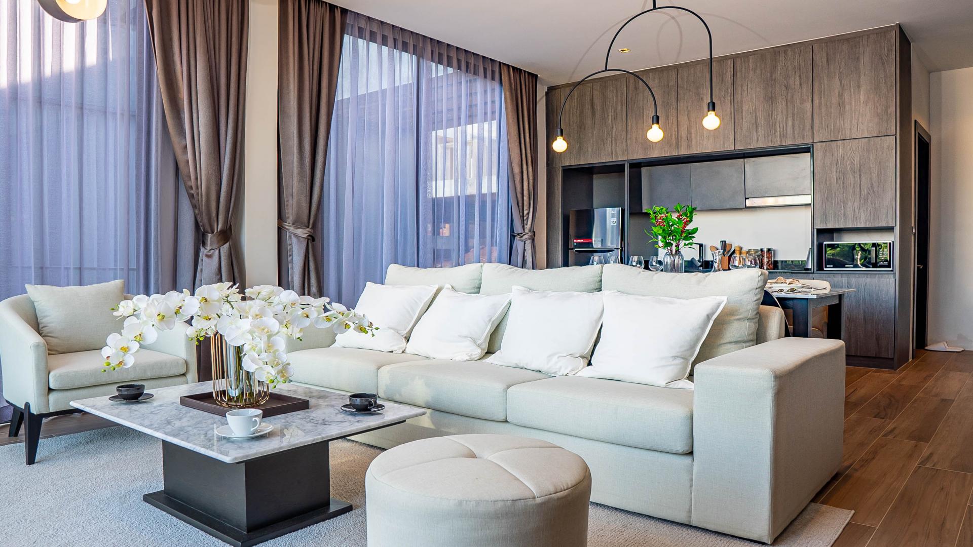 Modern living room in Phuket villa, featuring elegant decor and natural light