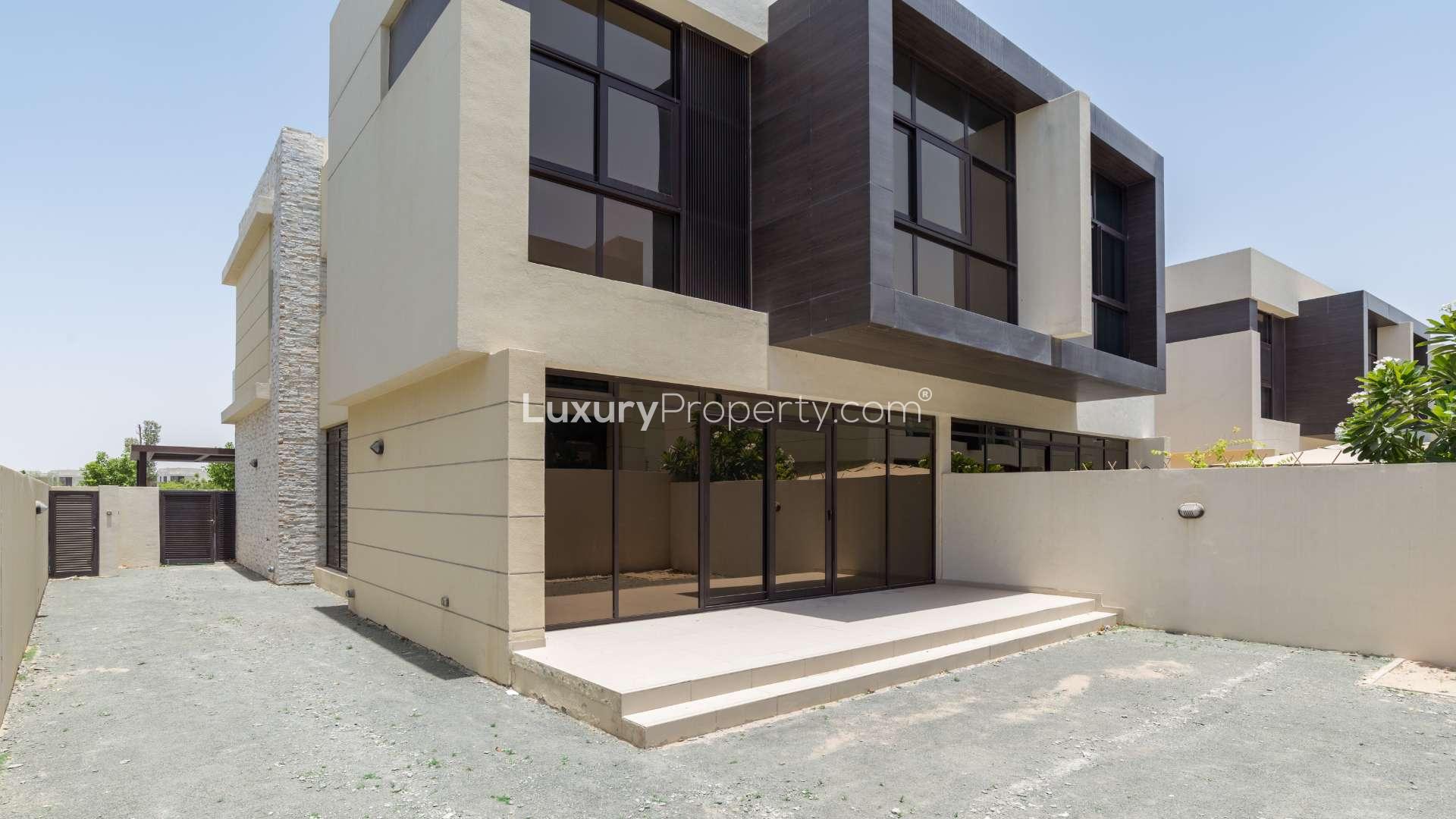 Spacious living area in semi-detached villa, Damac Hills, with modern staircase and large windows
