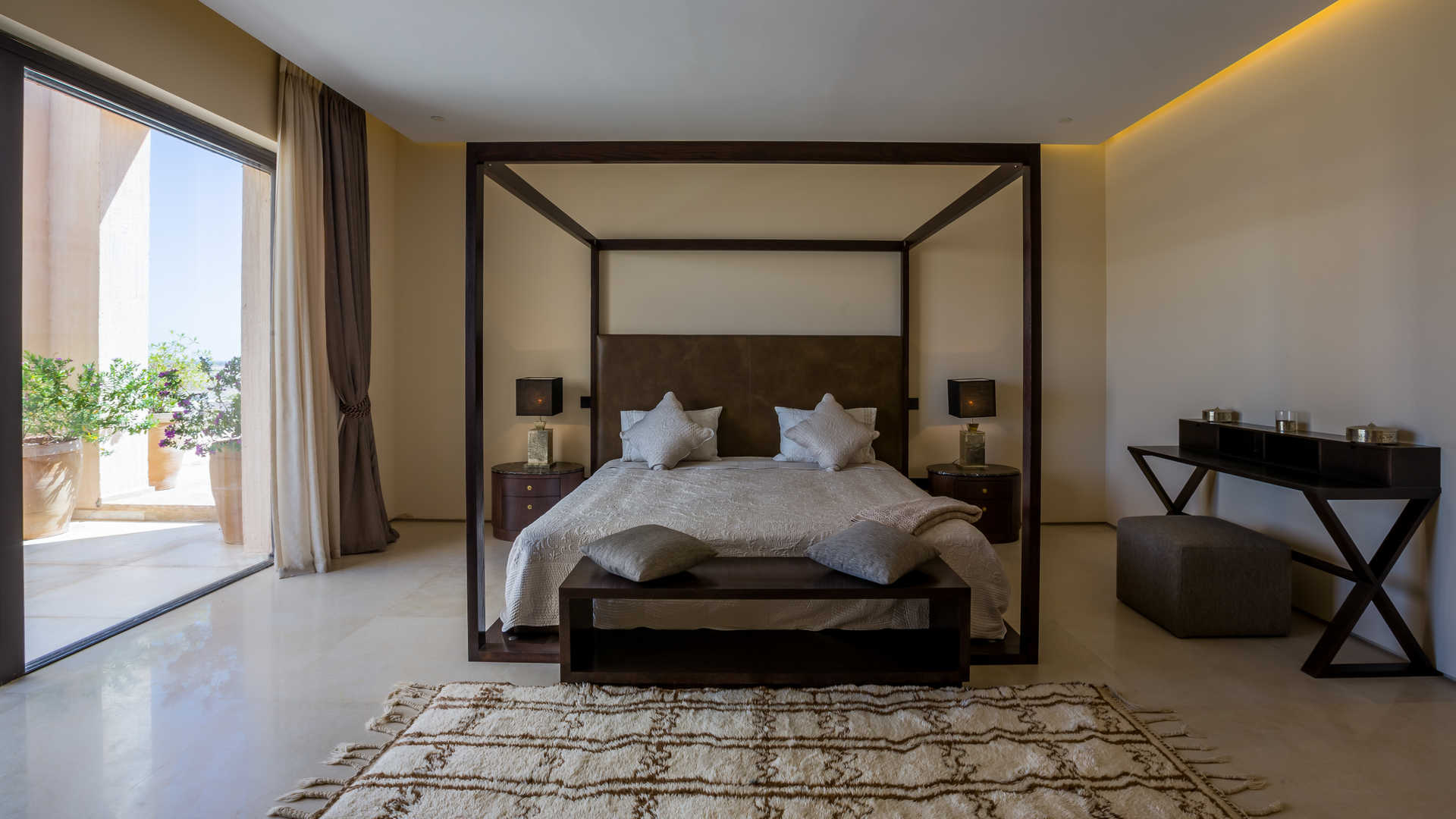Luxurious bedroom in three-bedroom villa at Ritz Carlton Residences Marrakech, with garden view