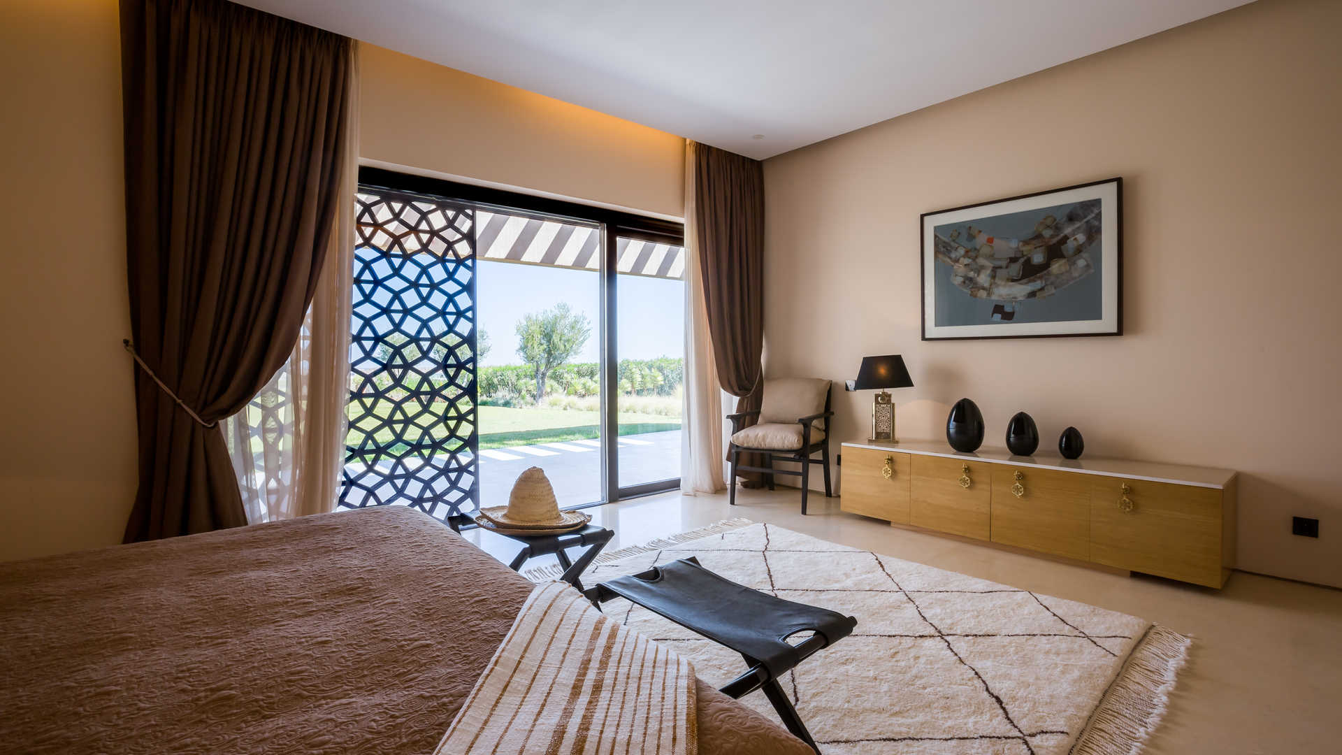 Luxurious villa patio with pool and mountain views at Ritz-Carlton Residences, Marrakech