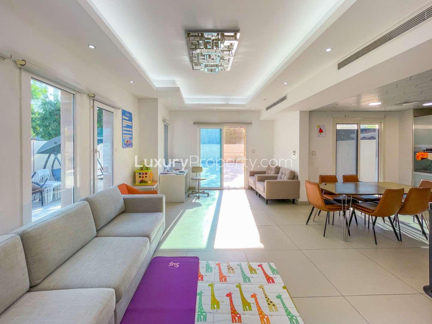 Bright master bedroom with balcony access in upgraded 3-bedroom villa, The Springs 2