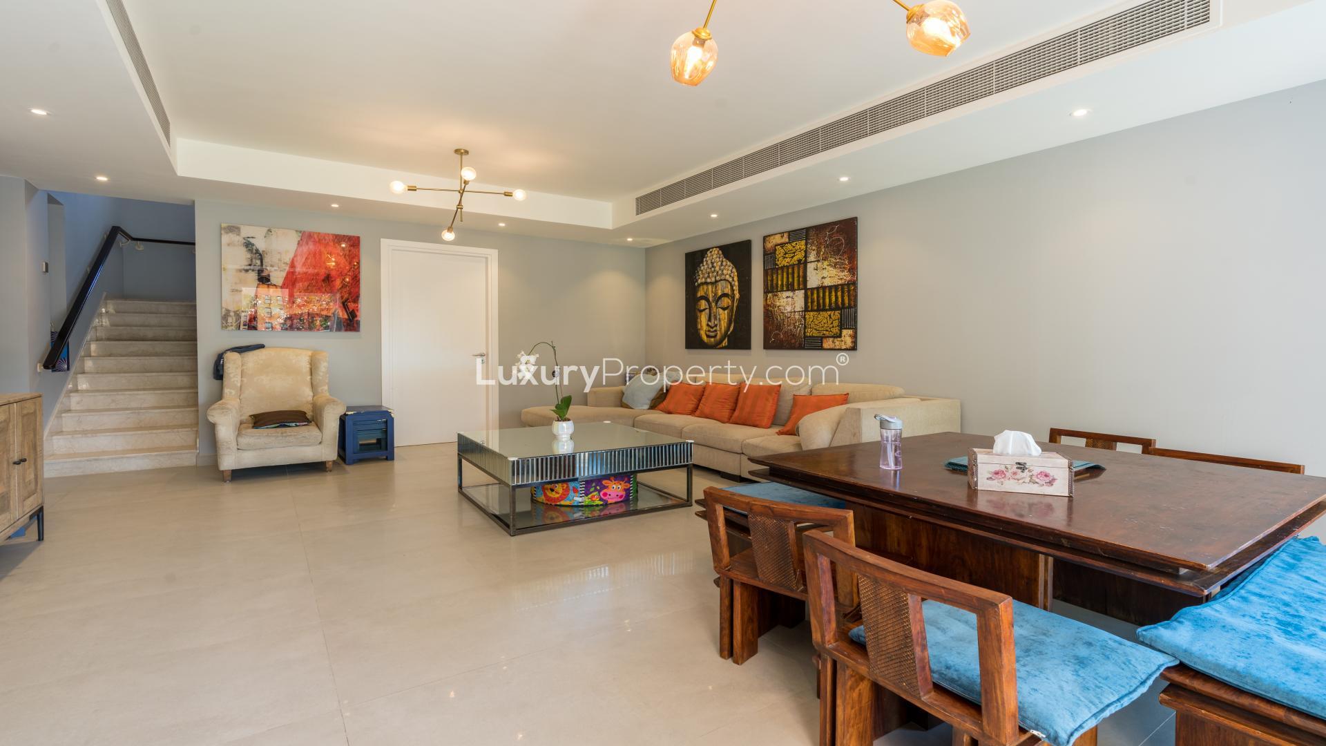 Upgraded villa garden with lush greenery and patio in The Springs, for sale