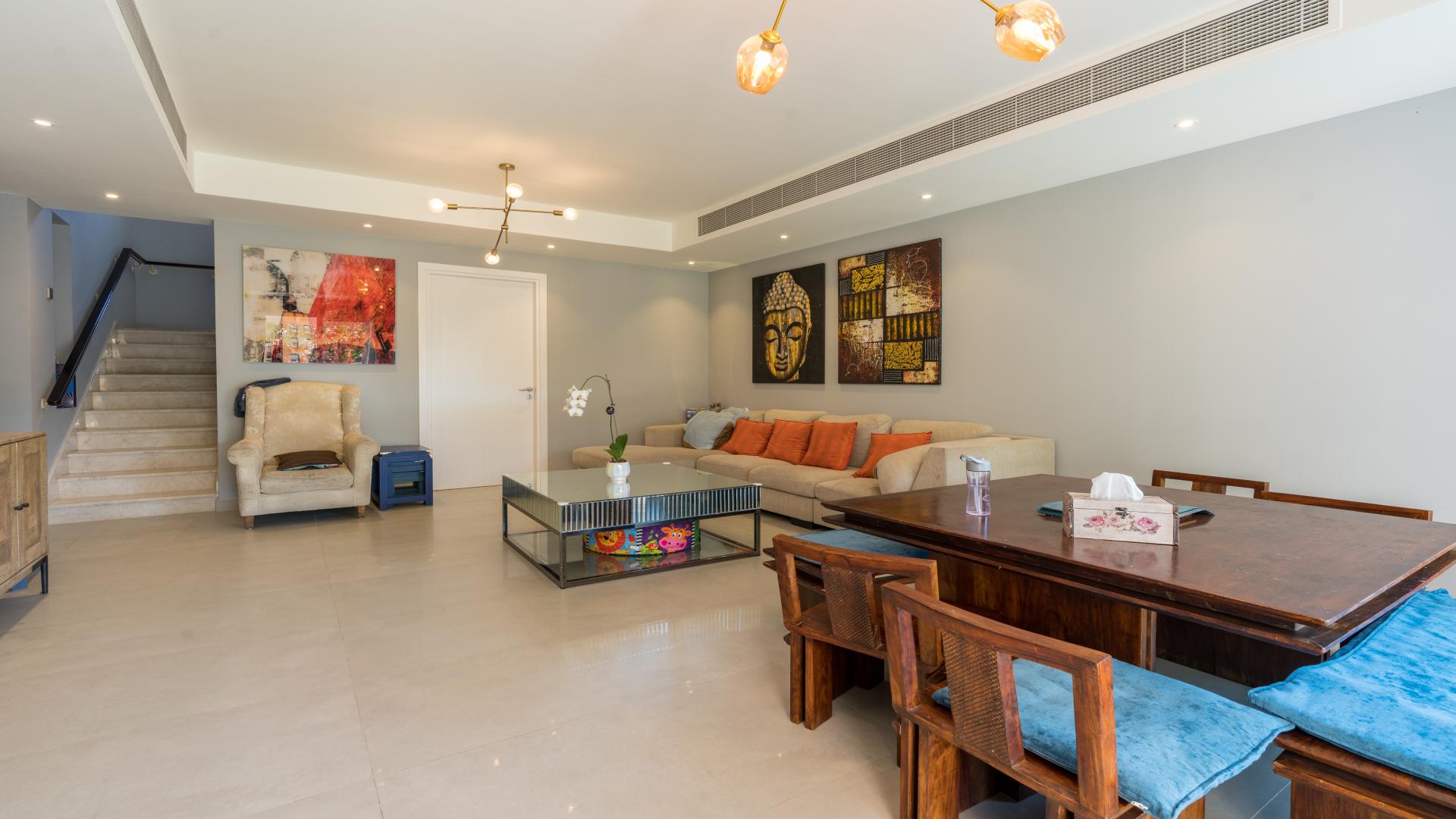 Upgraded villa garden with lush greenery and patio in The Springs, for sale