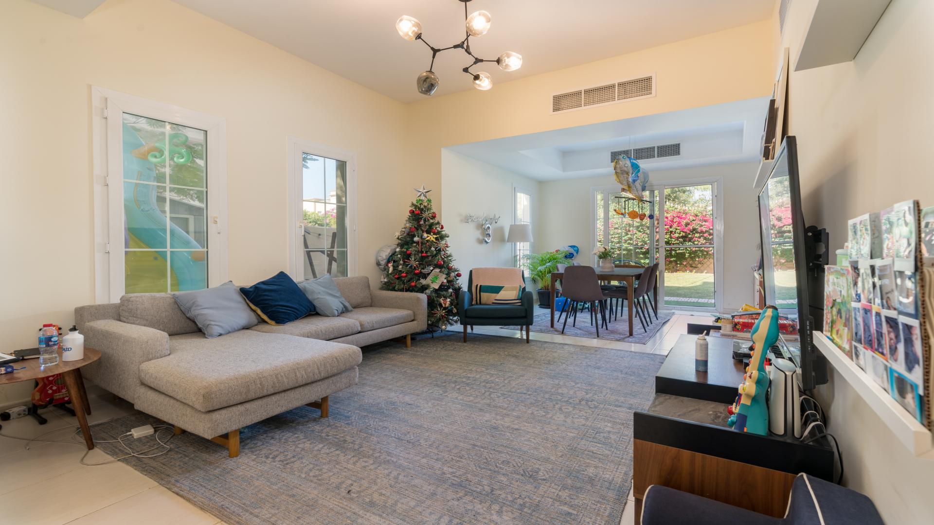 "Spacious garden of 3-bedroom villa for sale in Springs 11, The Springs community.",Living room with modern decor in 3-bedroom villa, Springs 11, The Springs