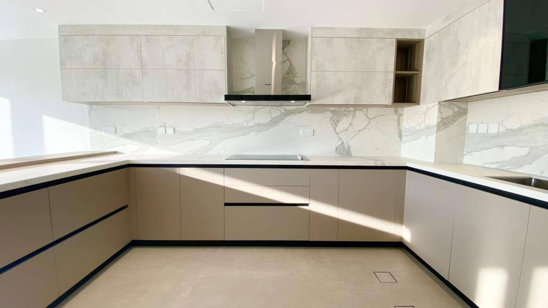 Modern kitchen with marble backsplash in renovated Type 1E villa, Springs 4, Emirates Living