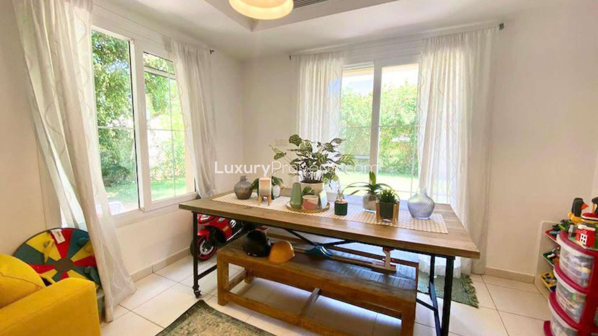 Lush garden view of 3-bedroom villa in The Springs, Dubai, Emirates Living