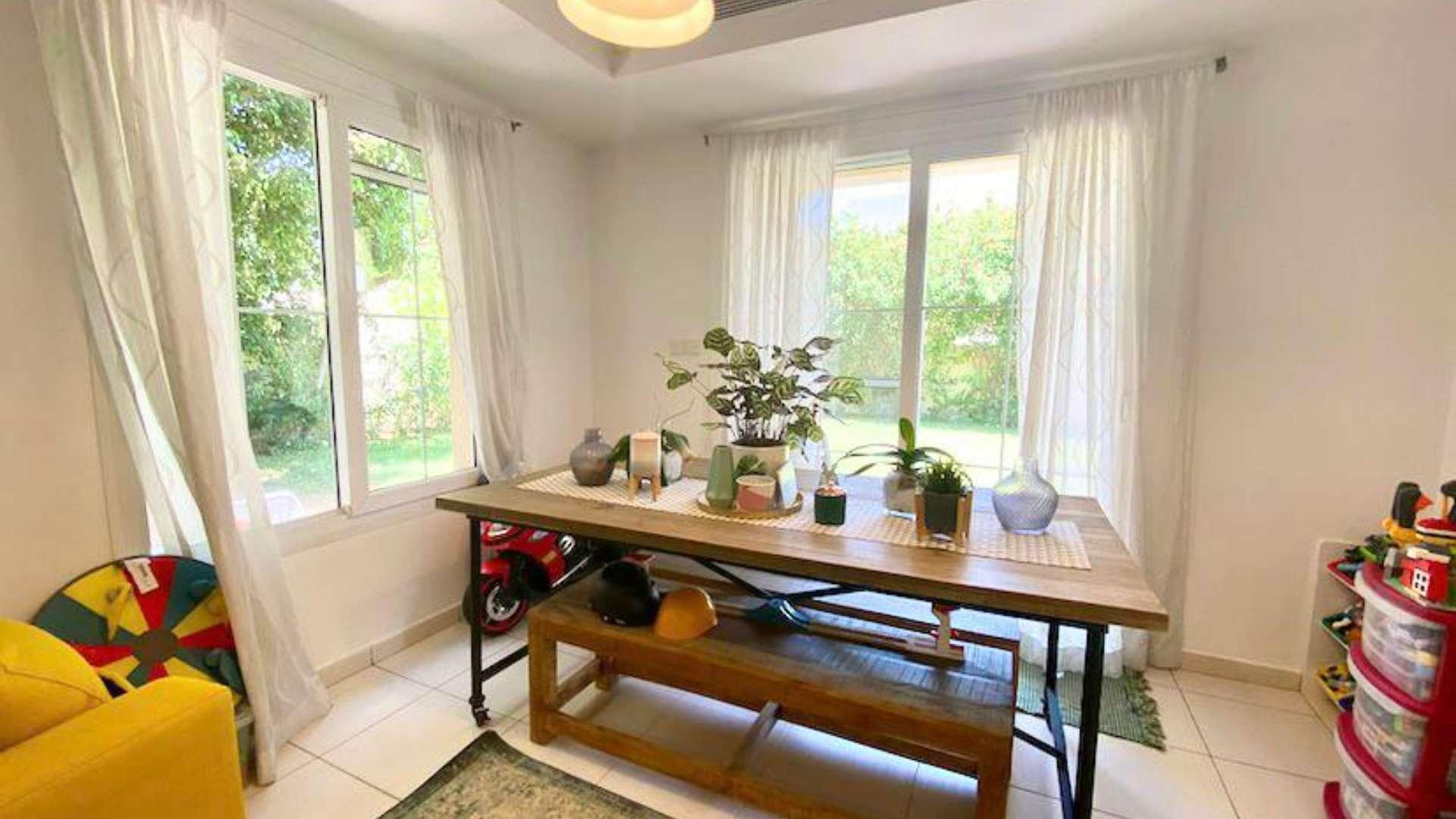 Lush garden view of 3-bedroom villa in The Springs, Dubai, Emirates Living