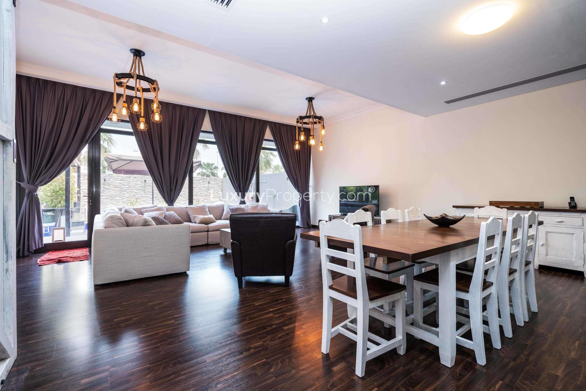 Luxurious living room with pool view in Damac Hills villa, Whitefield sub-community