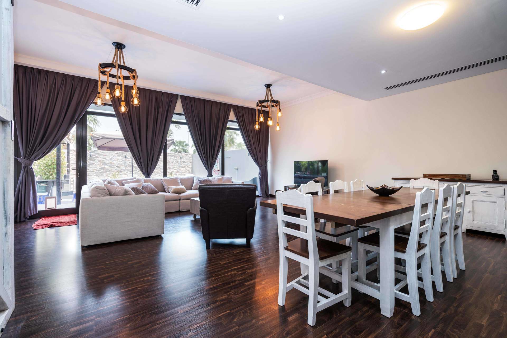 Luxurious living room with pool view in Damac Hills villa, Whitefield sub-community