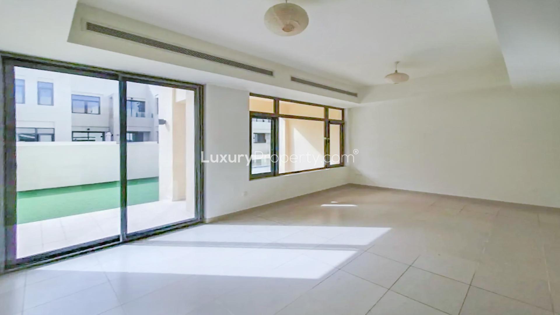 Luxurious 3-bedroom villa exterior in Mira Oasis, Reem, with garden view