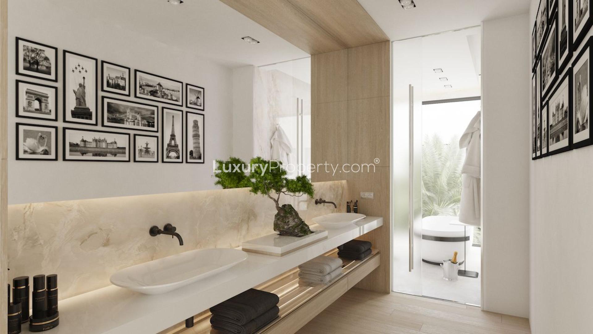 "Luxury garage with exotic cars in Marbella Golden Mile villa for sale.",Luxury bathroom in Marbella Golden Mile villa, featuring modern double sinks and elegant decor
