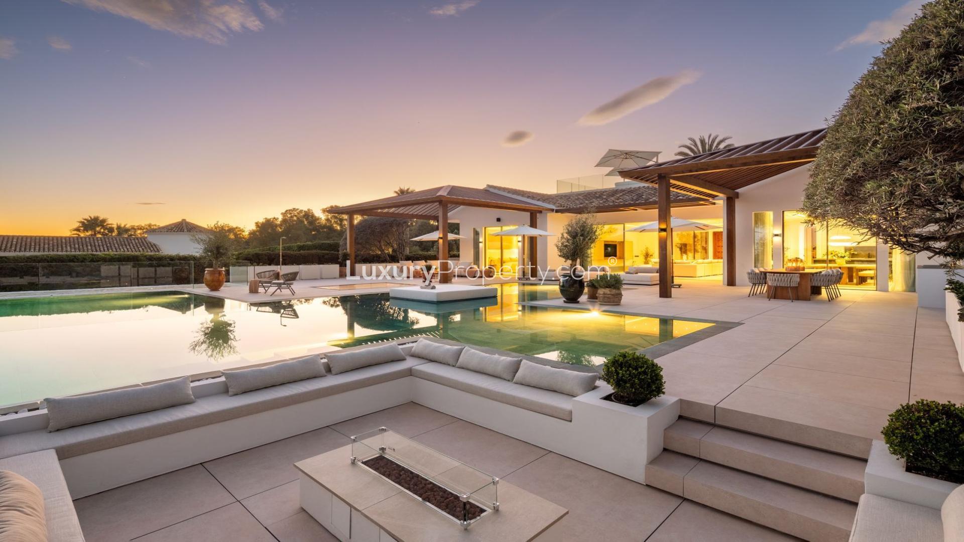 Luxury Nueva Andalucía villa patio with pool, golf views, and elegant outdoor seating