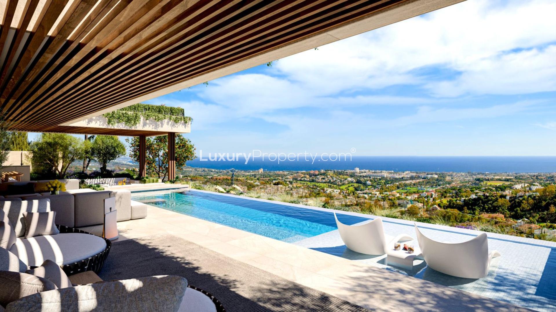 Outdoor dining area with ocean view at luxury villa in Benahavis, Marbella