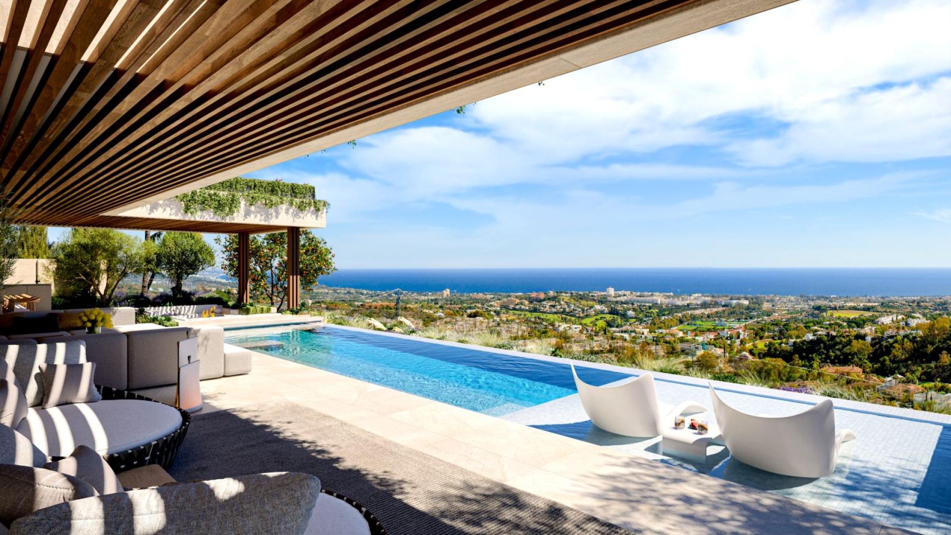 Outdoor dining area with ocean view at luxury villa in Benahavis, Marbella