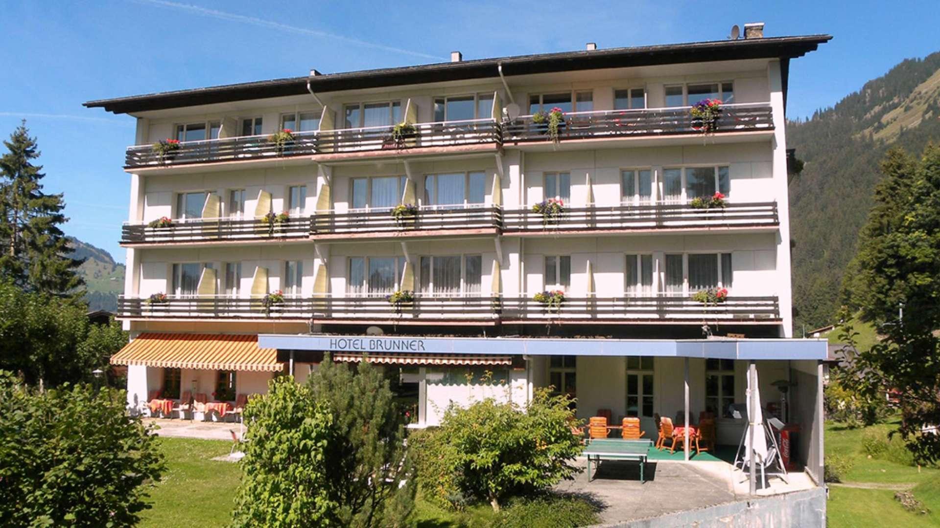 Incredible Ski Hotel Brunner for sale in Wengen, Switzerland, surrounded by scenic mountains