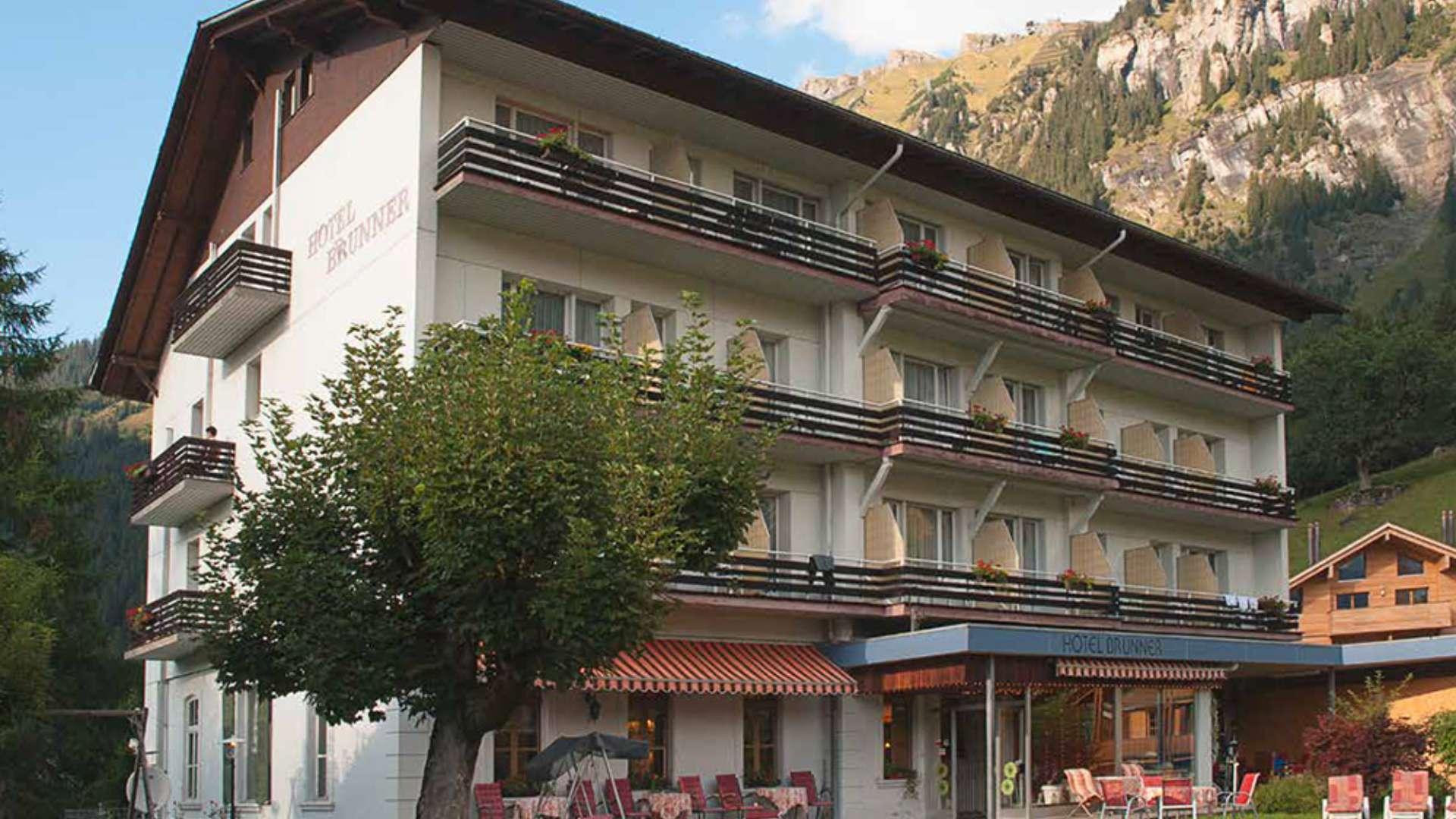 Incredible Ski Hotel Brunner exterior in Wengen, Switzerland, surrounded by scenic mountain views