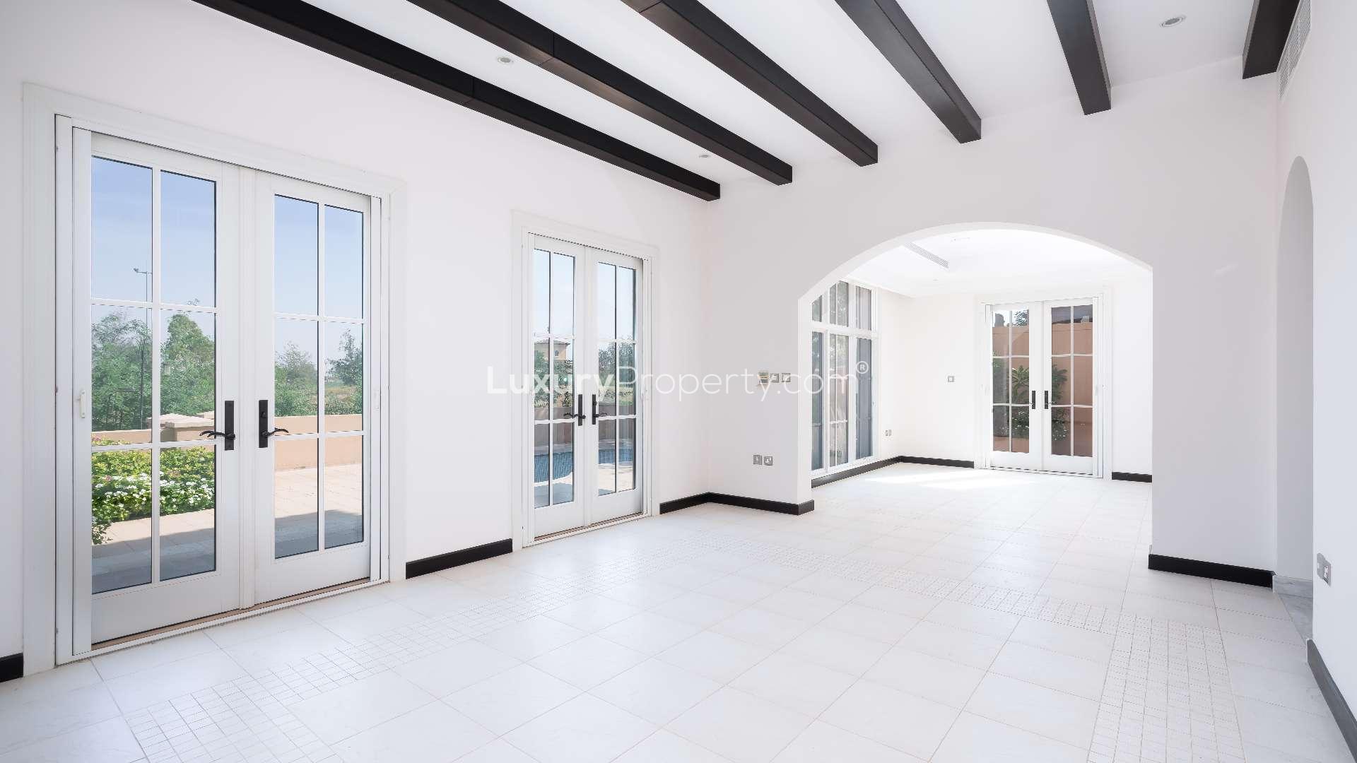 Beautiful 4-bedroom villa exterior with garage in Jumeirah Golf Estates, Earth community. For rent