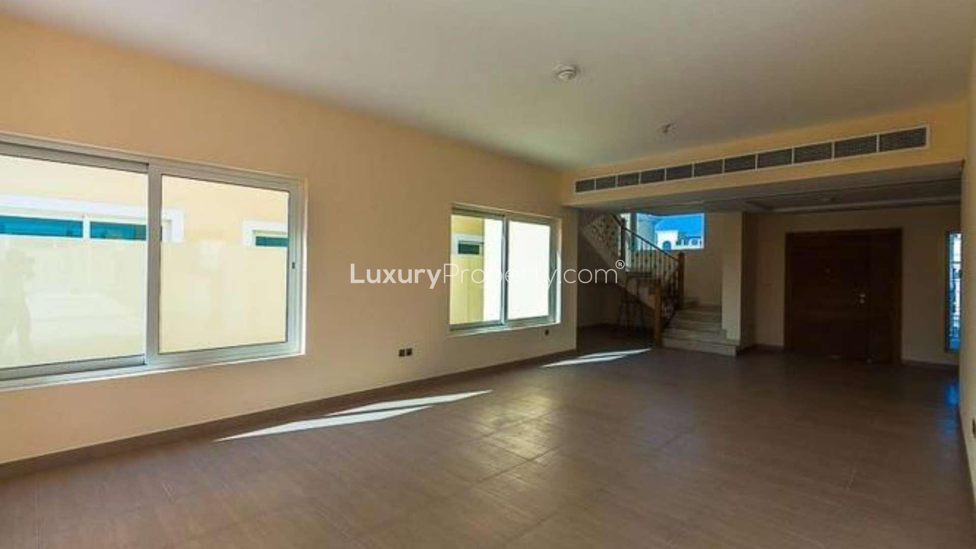 Spacious living area with large windows in Legacy Nova Villa, Jumeirah Park for rent