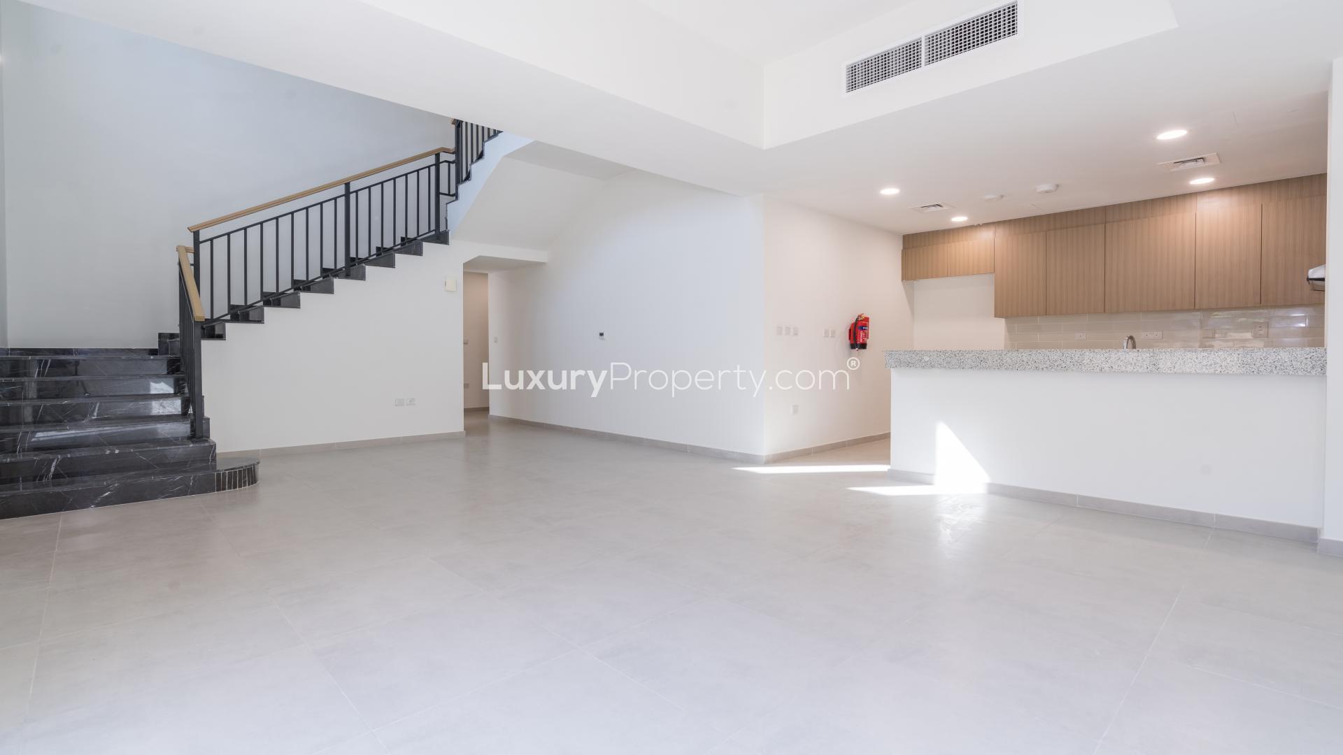 Spacious living area in 4-bedroom Amaranta villa, Villanova, Dubai Land, with modern staircase