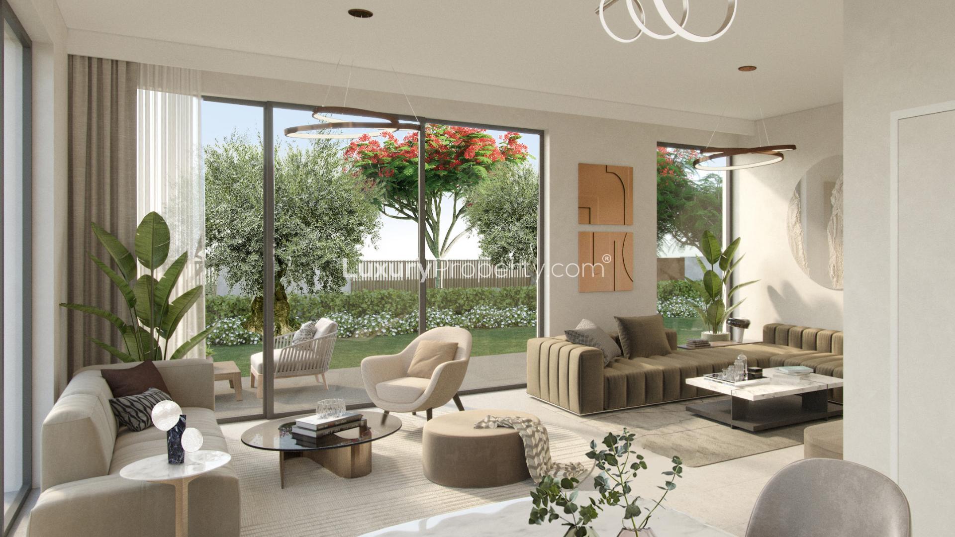 Stunning 4-bedroom twin villa exterior in Tilal Al Ghaf, Aura community, lush landscaping
