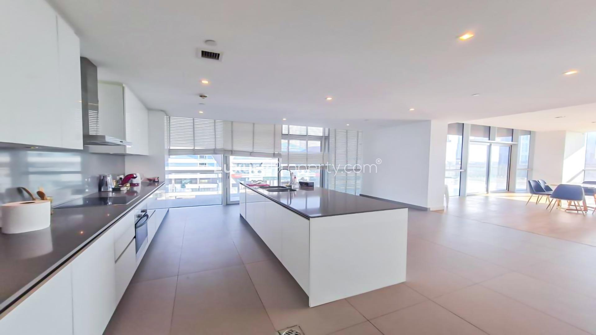 Luxurious living room with modern furniture and city views in City Walk, Dubai apartment