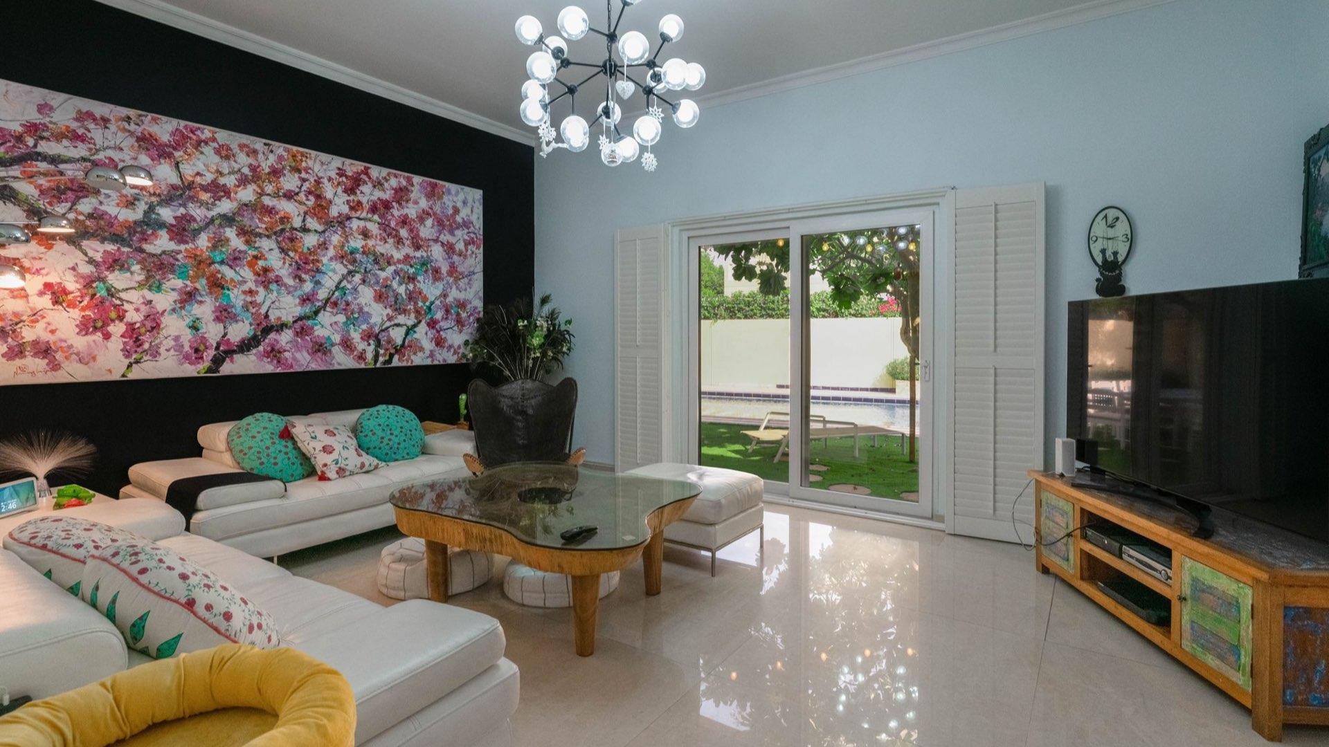 Spacious family villa interior with pool table and dining area in Meadows 9 for sale