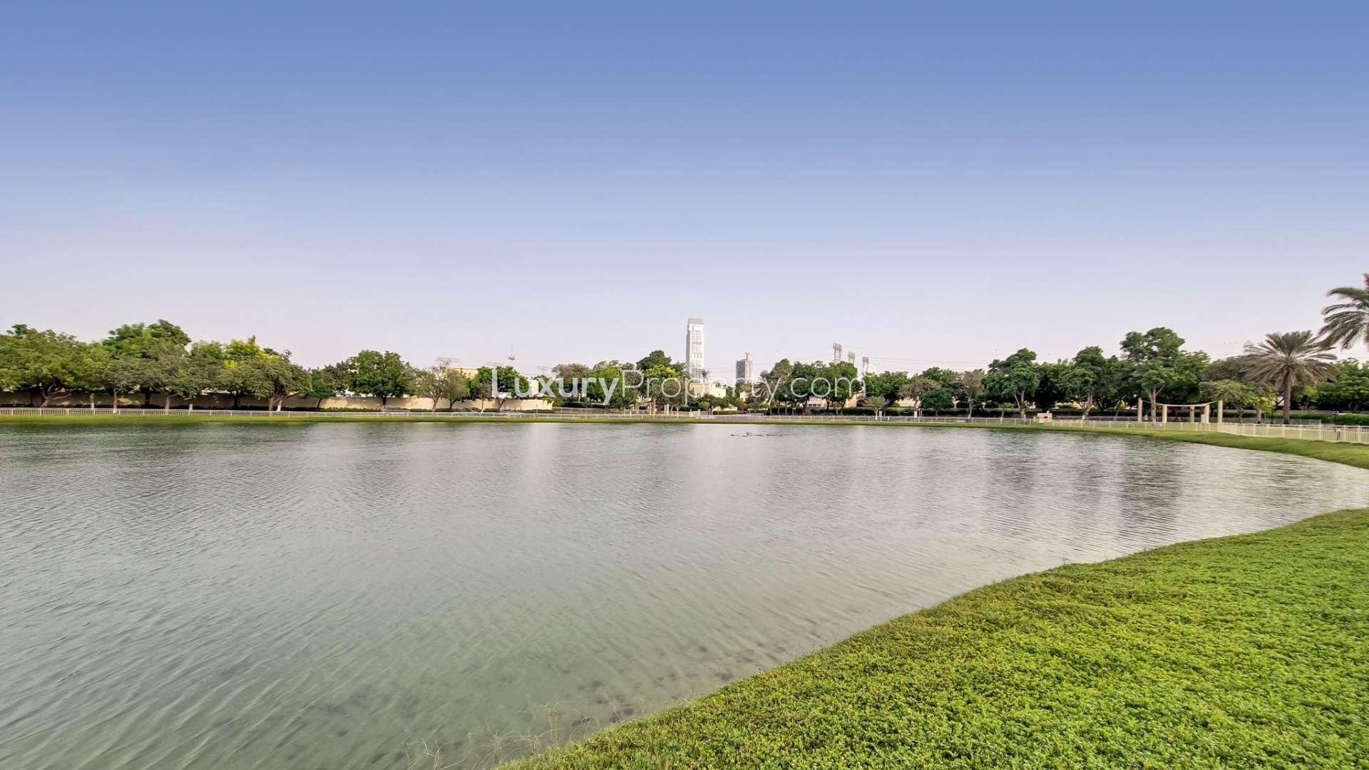 Living room of upgraded 4-bedroom villa in Meadows 9, featuring elegant decor and natural light