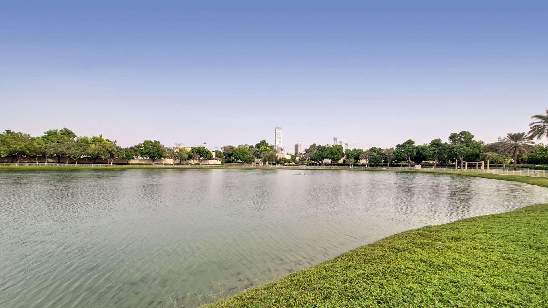 Living room of upgraded 4-bedroom villa in Meadows 9, featuring elegant decor and natural light
