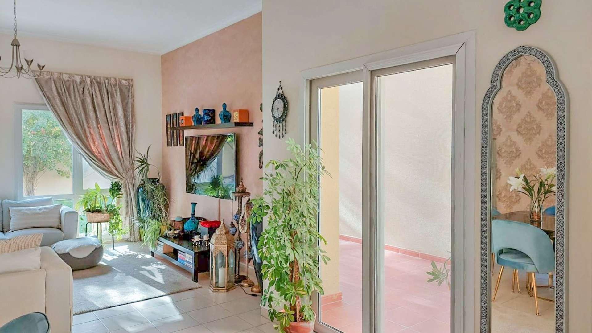 Exterior of Type 6 villa in Meadows 9 with patio and large windows